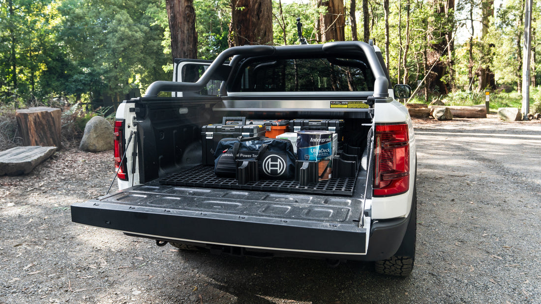 Open ute tray/tub camping setup with LockNMat modular organiser, storage boxes and 4WD touring gear