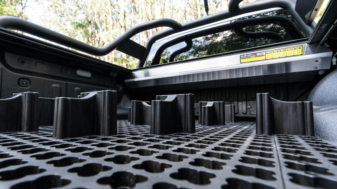 LockNMat modular ute tub organiser and blockers on the tray floor below a raised ute tub rack