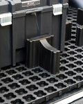 LockNMat locking blocker positioned beside a toolbox on a modular ute tray mat